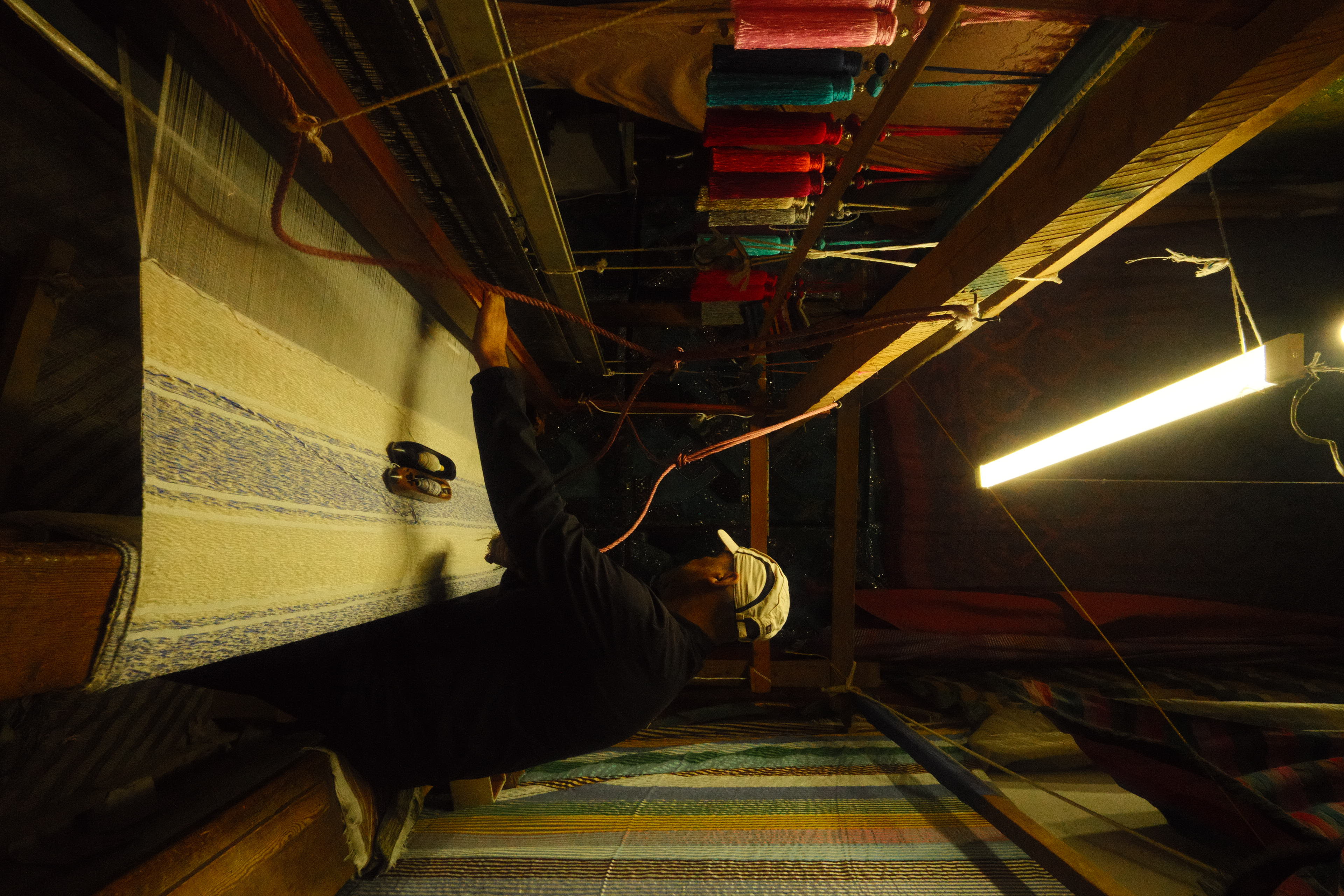 Moroccan artisan at loom